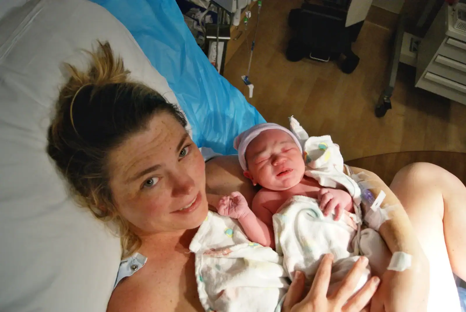Mother and newborn baby after delivery in hospital.