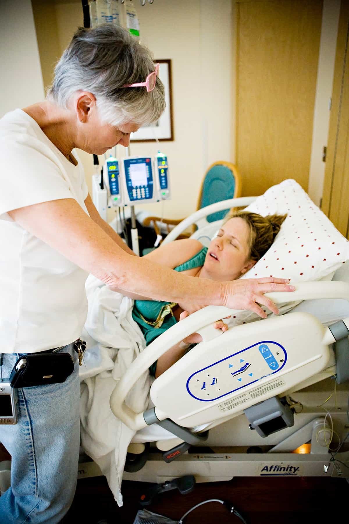 Doula answering a client's question between contractions.